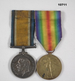 Two WW1 Medals mounted on a pin.