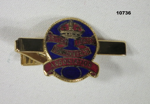 Metal tie clip with BCOF Association badge.