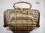 Folding bamboo basket with handles.