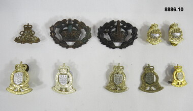 Various Military badges of different types.