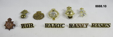 Various Military Badges of different types.