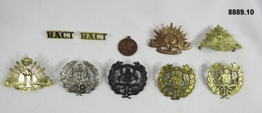 Various Military Badges of different types.