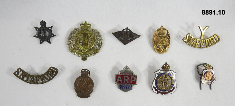 Various Military Badges of different types.