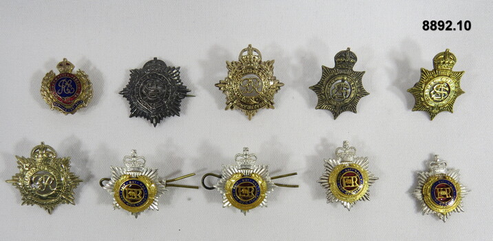Various Military Badges of different types.
