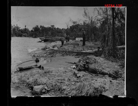 10784.13P Japanese landing barge and dead Japanese Buna
