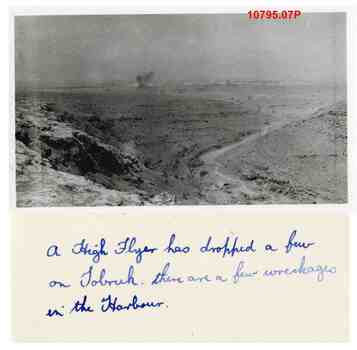 10795.07P Tobruk harbour under bombardment