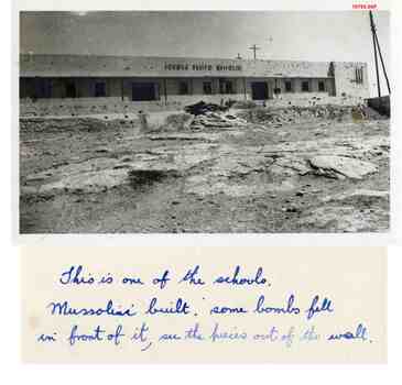 10795.09P Scholl built by Italians during occupation, scarred by bombing