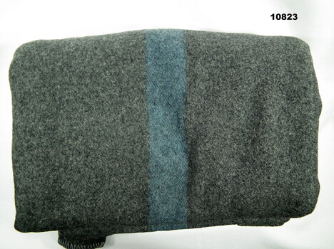 Grey Army blanket with blue stripes.