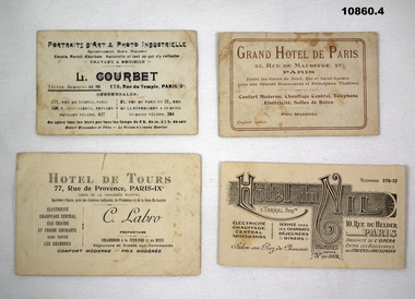Four business cards from Parisian businesses.