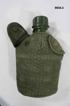 Water bottle and canteen in carrier.