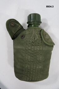 Water bottle and canteen in carrier.
