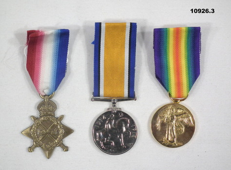 Three replicas of WW1 medals.