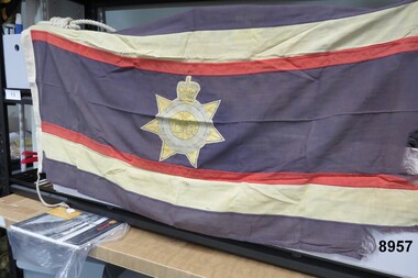 Faded damaged flag with inscription E.R.