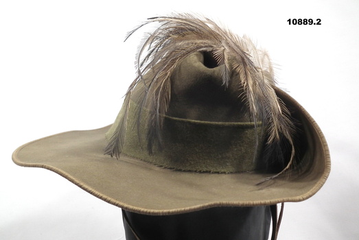 Khaki fur felt slouch hat with feathers.