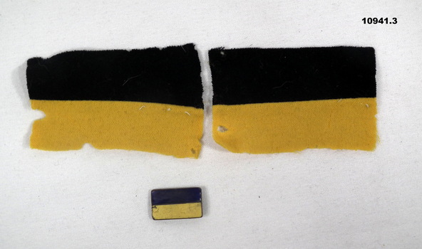 Two 14th Battalion colour patches and a 14th Battalion Association Badge.