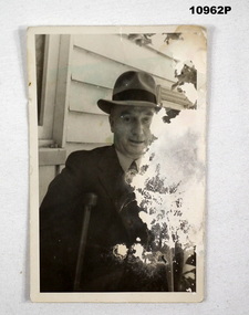 Black and white photograph of a man in a suit.
