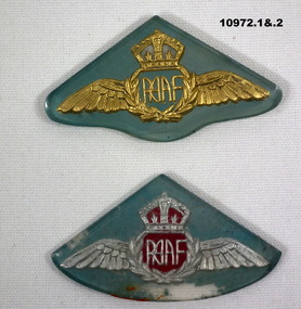 Collection of partially and fully completed badges and brooches.