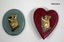 Collection of partially and fully completed badges and brooches.