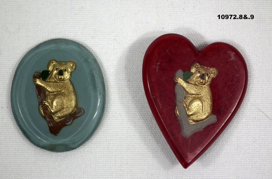 Collection of partially and fully completed badges and brooches.