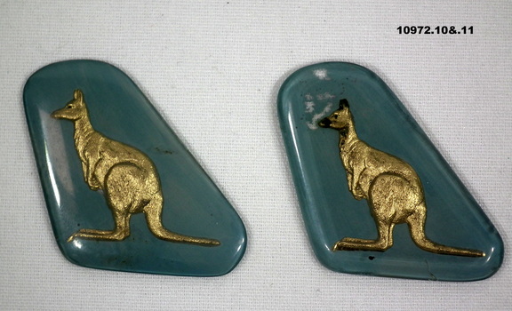 Collection of partially and fully completed badges and brooches.