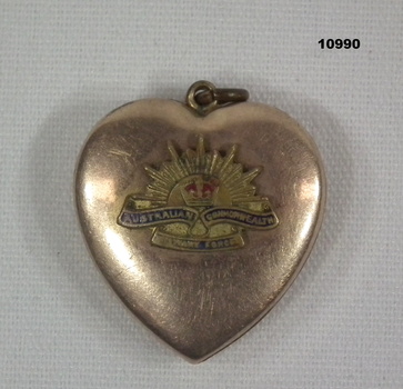 Heart shaped locket with Rising Sun Badge.
