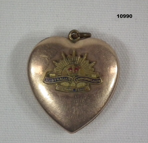 Heart shaped locket with Rising Sun Badge.