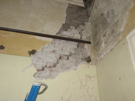 Damage to the front Office wall.
