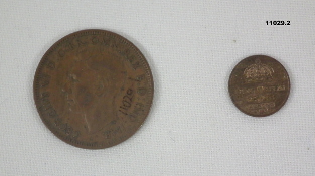 Two copper coins - One is a Penny, one is a Koning.