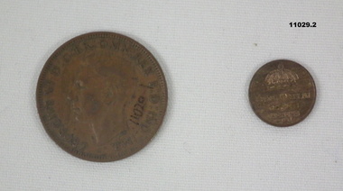 Two copper coins - One is a Penny, one is a Koning.