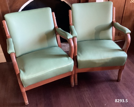Five green vinyl Arm chairs.