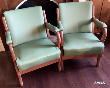 Five green vinyl Arm chairs.
