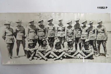Black and white photograph of 16 soldiers pre WW1. 