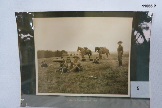 Black and white photo, troops training in camp 1913.