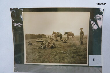 Black and white photo, troops training in camp 1913.