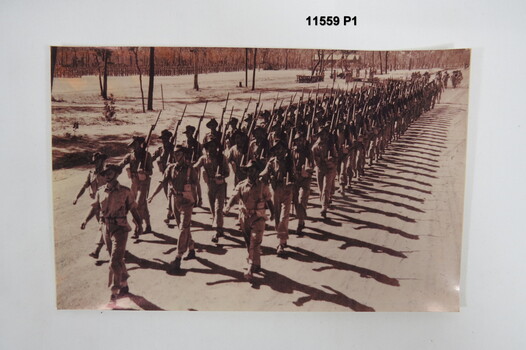 Photograph of Troops marching.