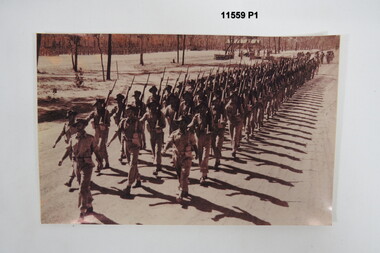 Photograph of Troops marching.
