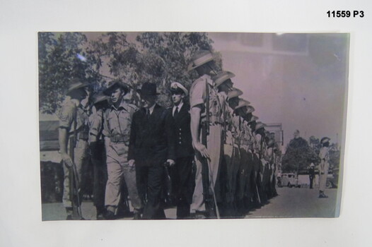 Photograph of soldiers on parade being inspected.