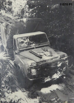 Black and white photos of Army Land Rovers.