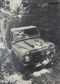 Black and white photos of Army Land Rovers.