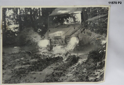 Black and white photo s of Army Land Rovers.