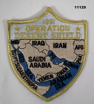 Shield shaped cloth shoulder badge featuring map of the Middle East.
