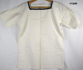 White, short sleeve shirt with navy blue edging around square neck opening.