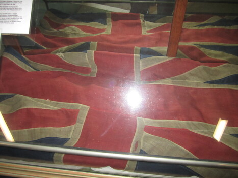 The Banner is a large red ensign displayed in a glass case for protection from the elements