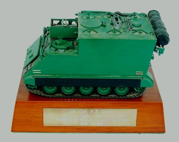 1:35 scale model of M577A1 ACV, mounted on wooden base