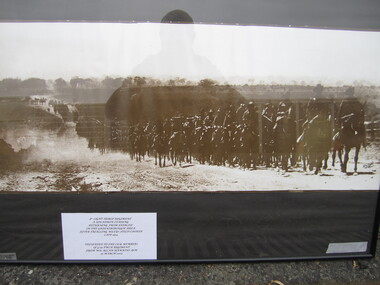 Landscape framed photograph showing 8th Light Horse Regiment, A Squadron leading, returning from exercise in the Greensborough area after trialing Wileys (sic) field cooker