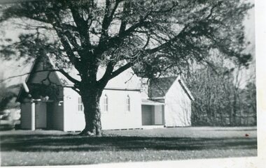 Photographs – Set of 4 black and white photographs.  One of a wooden church and three of  rural homes and farmland. Area not identified