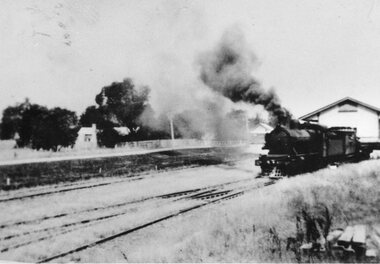 Photographs – Set of 3 black and white photographs of a building being transported by  steam train