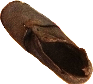 This is a small child’s brown shoe made of leather with a lace-up upper part (no laces) and a leather sole.  