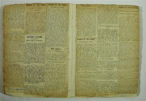 A used exercise book repurposed as a scrapbook of First World War letters 