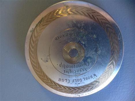 Ladies face powder compact with some inscription.